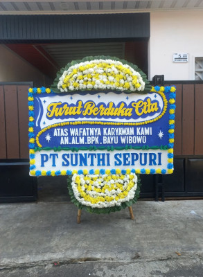Papan Bunga Duka di Motto
