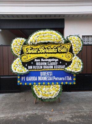 Papan Bunga Duka di Motto